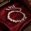 Amuleto do Amor Próprio - pulseira amuleto Ruvi em tons de rosa com borboletas
